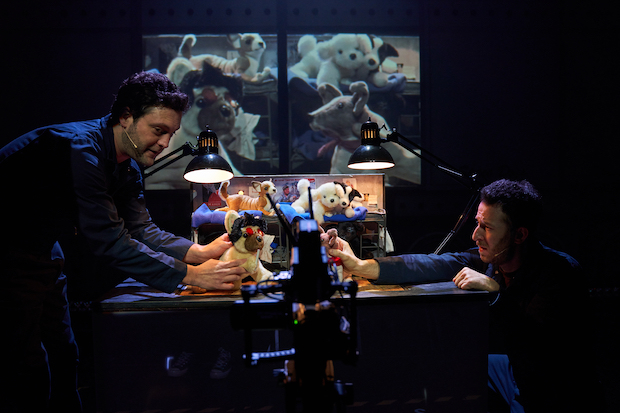 Van Hughes and Nick Blaemire manipulate puppets in Space Dogs. 