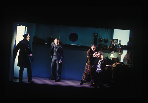 After the Titanic hits an iceberg, John Cunningham as Captain Smith, Michael Cerveris as Thomas Andrews, David Garrison as J. Bruce Ismay, and Martin Moran as Harold Bride struggle for a way to stay upright.