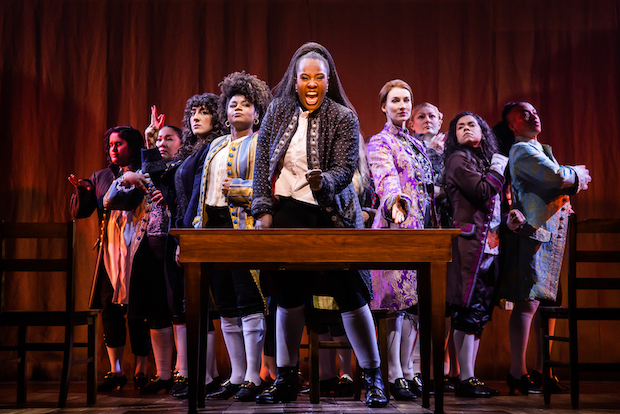Sushma Saha, Sara Porkalob, Mehry Eslaminia, Gisela Adisa, Crystal Lucas-Perry, Elizabeth A. Davis, Becca Ayers, Brooke Simpson, and Oneika Phillips appear in the A.R.T. and Roundabout Theatre Company revival of 1776, directed by Jeffrey L. Page and Diane Paulus. 