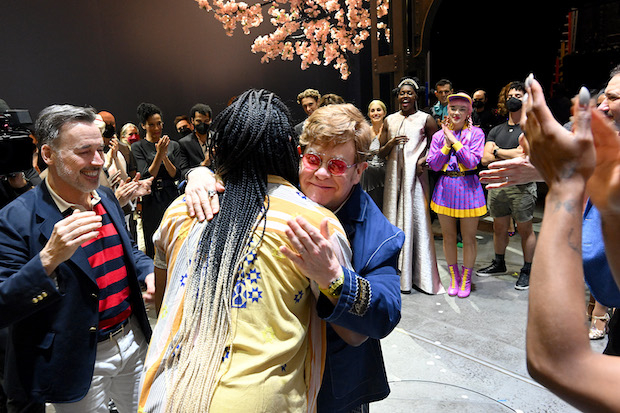 Elton John embraces choreographer James Alsop. 
