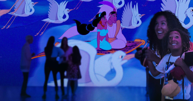 Guests enjoy a scene from Aladdin in Disney Animation: Immersive Experience. 