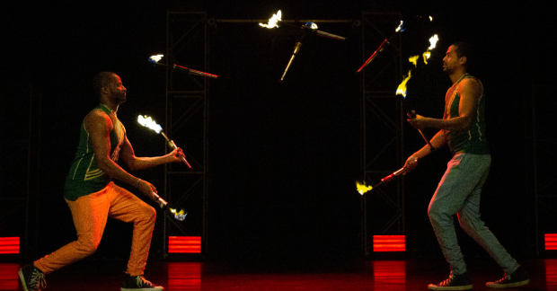 Brothers Mehari and Binyam Tesfamariam, &quot;Bibi&quot; and &quot;Bichu,&quot; perform their fire juggling act in Circus Abyssia: Tulu at the New Victory Theater. 
