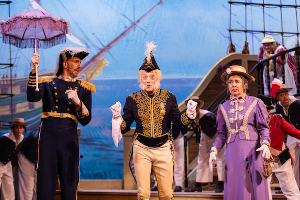 David Auxier plays Captain Corcoran, James Mills plays Sir Joseph Porter, and Victoria Devany plays Cousin Hebe in H.M.S. Pinafore, directed by Albert Bergeret, for New York Gilbert and Sullivan Players at the Kaye Playhouse. 