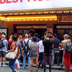 Fans regularly spill off the sidewalk into 49th street, hoping their names will be drawn in the Book of Mormon lottery. 