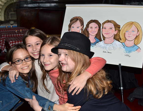 Oona Laurence, Bailey Ryon, Sophia Gennusa, and Milly Shapiro share a group hug.
