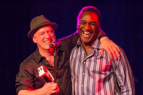 Norm Lewis and director Donnie Kehr share a hug onstage.