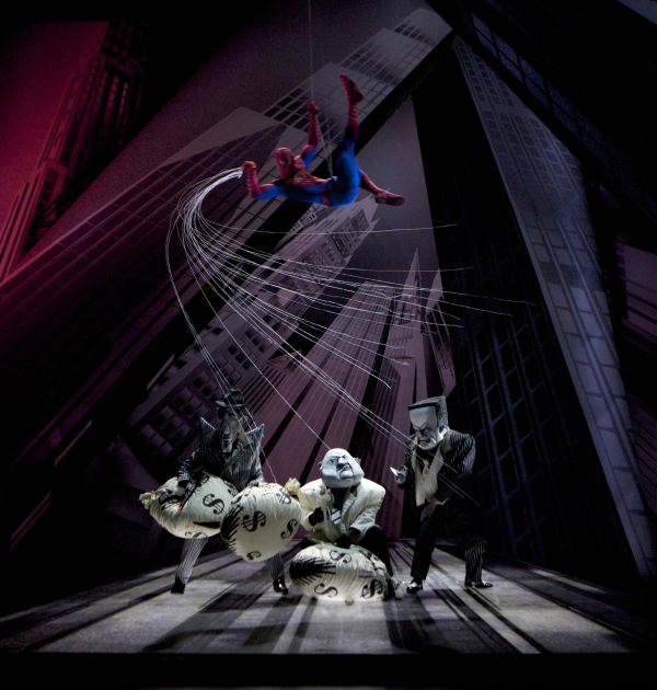 Spider-Man vanquishes a trio of bank robbers in Spider-Man Turn Off the Dark.