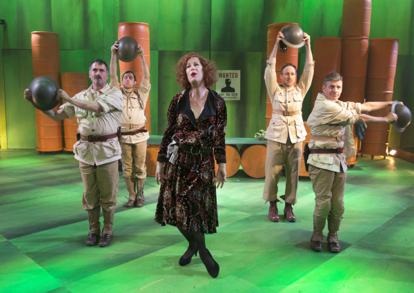 Steven Skybell, Jason Babinsky, Gibson Frazier, and Martin Moran play four machine gunners in Her Majesty's army. They dance around Justin Vivian Bond, who plays the Widow Begbick in A Man's A Man at Classic Stage Company. 