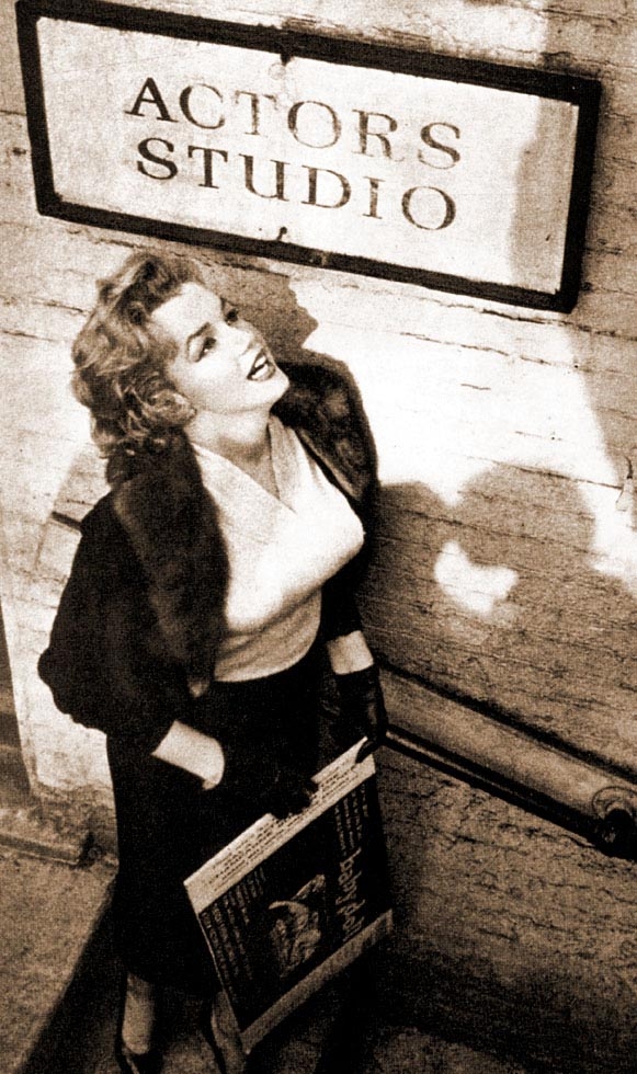 Marilyn Monroe outside stands beneath the Actor&#39;s Studio sign in 1956.