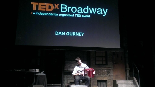 Dan Gurney opens his TED talk with a tune on the button accordion. 