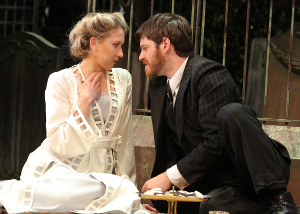 Heléna (Nina Arianda) and Béla (Michael Esper) make out in a graveyard in the Manhattan Theatre Club production of David Grimm&#39;s Tales From Red Vienna, directed by Kate Whoriskey, at New York City Center Stage I.