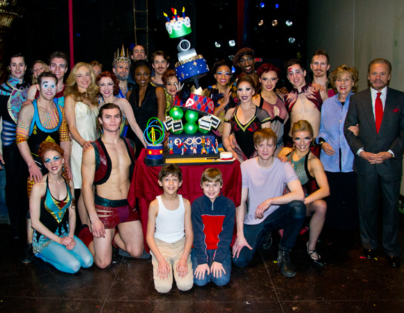 The cast and creative team of Broadway&#39;s Pippin poses with a death-defying, multilayer treat.