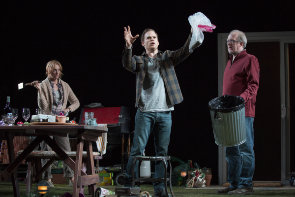 Toni Collette, Michael C. Hall, and Tracy Letts dispose of a dead squirrel in Will Eno&#39;s The Realistic Joneses, directed by Sam Gold, at Broadway&#39;s Lyceum Theatre. 