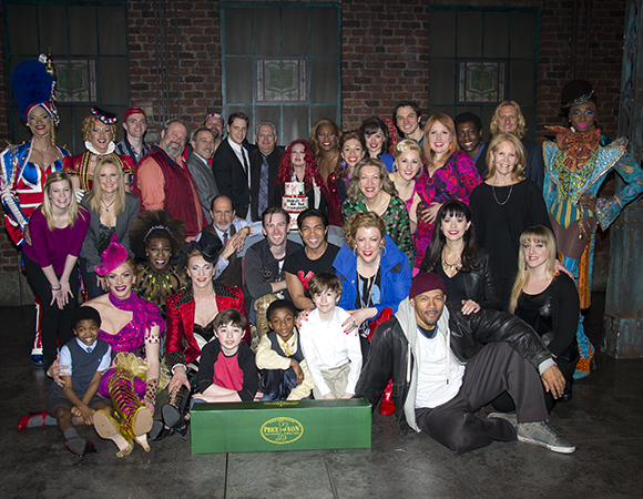 Members of the Kinky Boots family come together for a group photo with their tasty surprise.