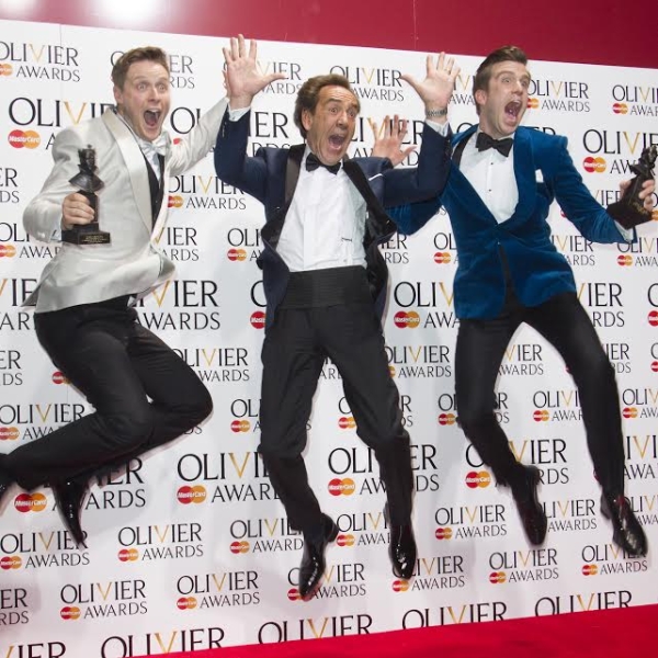 Stephen Ashfield, Robert Lindsay, and Gavin Creel celebrate at the WhatsOnStage Awards.