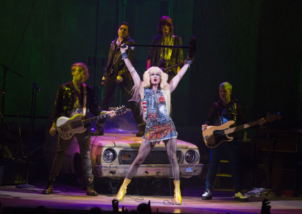 Hedwig (Neil Patrick Harris) is backed up by her band, the Angry Inch: Krzyzhtoff (Tim Mislock), Yitzhak (Lena Hall), Skszp (Justin Craig), and Jacek (Matt Duncan) in John Cameron Mitchell and Stephen Trask&#39;s Hedwig and the Angry Inch, directed by Michael Mayer, at the Belasco Theatre. 