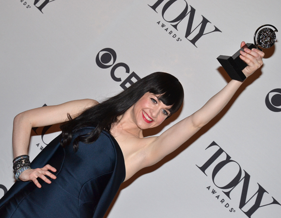 Lena Hall shows off her Tony Award in the press room.