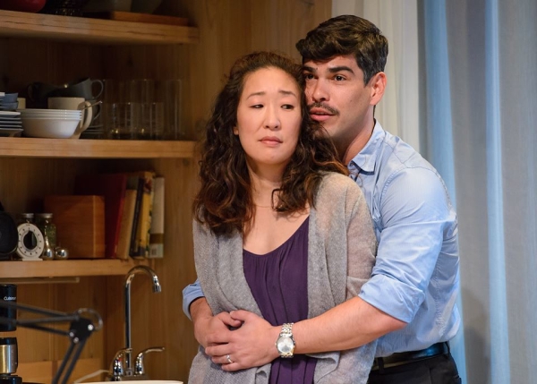 Sandra Oh as Paulina Salas and Raúl Castillo as her husband, Gerardo, in Ariel Dorfman's Death and the Maiden, directed by Chay Yew at Chicago&#39;s Victory Gardens Theater.