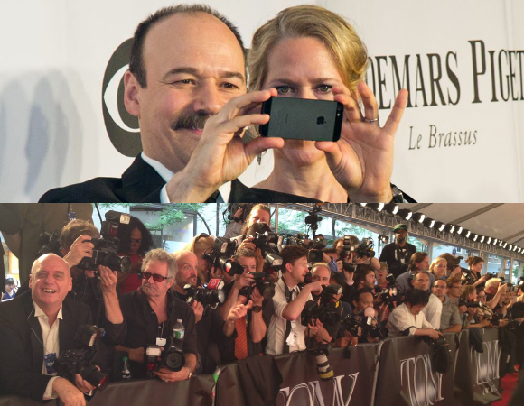 Danny Burstein takes a photo of the red carpet at the 2014 Tony Awards as his wife, Rebecca Luker, looks on.