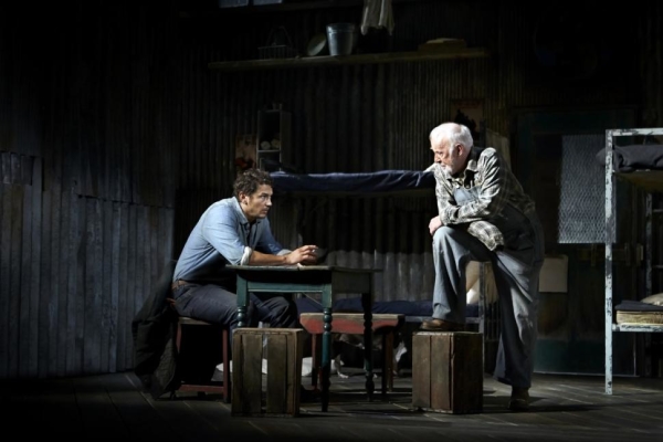 James Franco and Jim Norton perform a scene from John Steibeck&#39;s Of Mice and Men, directed by Anna D. Shapiro, at the Longacre Theatre. Violet the dog hangs upstage.