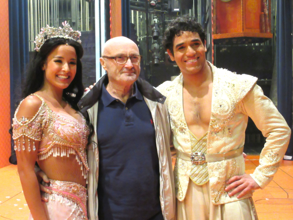 Aladdin&#39;s Courtney Reed and Adam Jacobs pose with singer-songwriter Phil Collins.