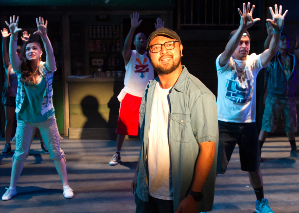 Joshua Lopez as Usnavi with the cast of In the Heights, directed by Oanh Nguyen, at Chance Theater.