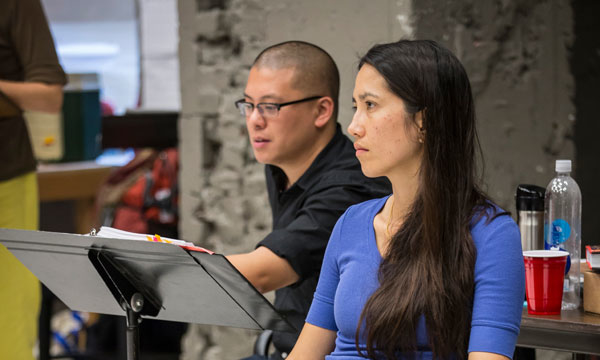 Playwright Francis Ya-Chu Cowhig with Director Eric Ting in rehearsal for the world premiere production of The World of Extreme Happiness at Chicago&#39;s Goodman Theatre.