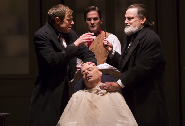 Greg Balla, Lee Sellars (seated), Tom Patterson, and Richmond Hoxie in a scene from Ether Dome.  