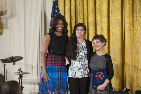 Marilyn Halperin (at right), CST Director of Education, and current program participant Jennifer Guadalupe Gonzalez (center) accepted the 2014 National Arts and Humanities Youth Program Award, presented by First Lady Michelle Obama, on behalf of Chicago Shakespeare Theater .