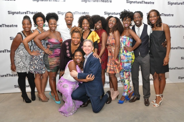 Cast members of Katori Hall&#39;s Signature Theatre Company plays Hurt Village and Our Lady of Kibeho rally around the playwright and Signature Artistic Director James Houghton (kneeling).