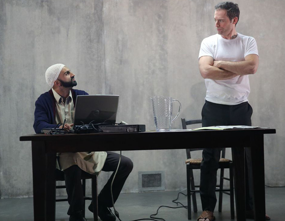 Usman Ally and Justin Kirk in Ayad Akhtar&#39;s The Invisible Hand at New York Theatre Workshop.