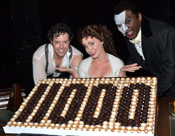 The Phantom of the Opera stars Greg Mills (Raoul), Sierra Boggess (Christine), and Norm Lewis (The Phantom) celebrate the musical&#39;s milestone 11,000th performance at the Majestic Theatre on July 7.