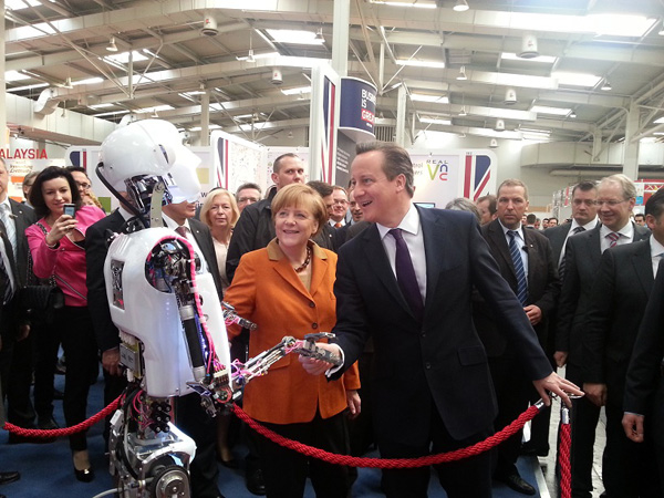 Friends in high places: RoboThespian meets German Chancellor Angela Merkel and British Prime Minister David Cameron at CeBIT, the world&#39;s largest computer expo. 